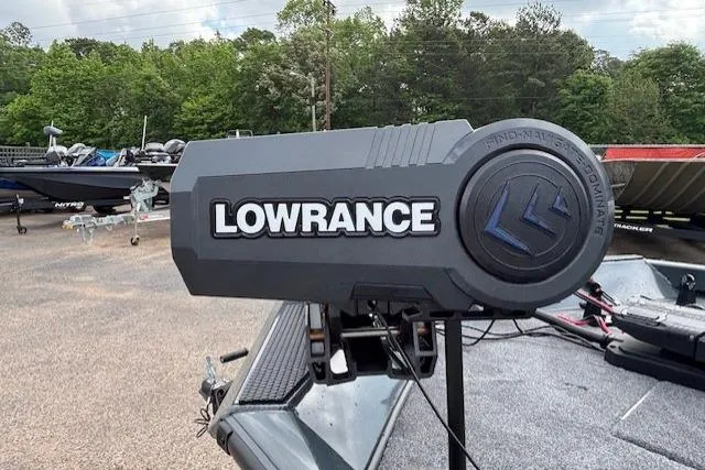 Slide: The Image of 2026 Ranger RT178C boat with Lowrance equipment, parked outdoors with trees in the background. - 10