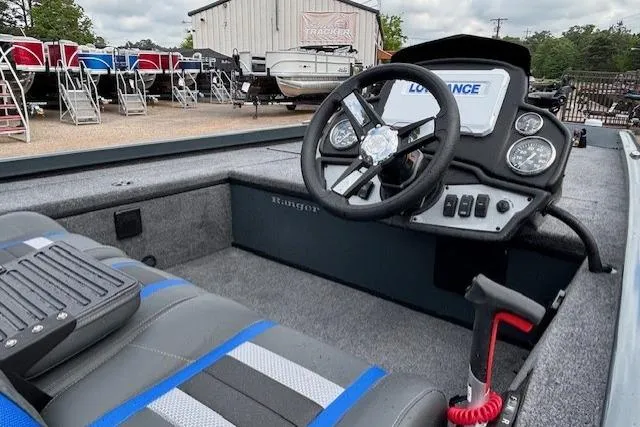 Slide: The Image of 2026 Ranger RT178C boat interior with steering wheel and dashboard controls. - 13