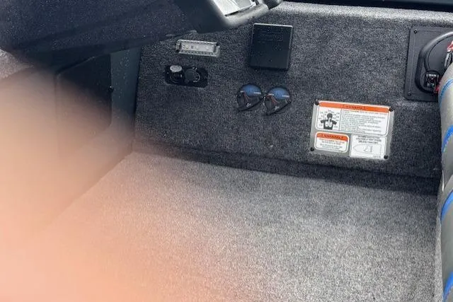 Slide: The Image of Interior view of 2026 Ranger RT178C boat with carpeted flooring and control panel. - 16