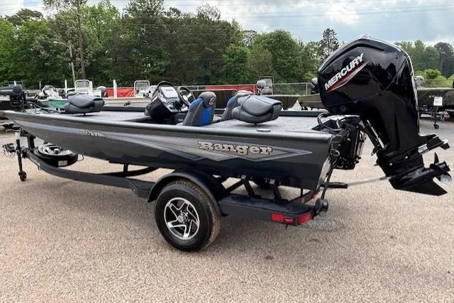 Slide: The Image of 2026 Ranger RT178C fishing boat with Mercury outboard motor, parked on a trailer. - 2