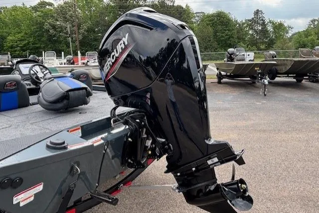 Slide: The Image of 2026 Ranger RT178C boat with Mercury outboard motor in a parking lot. - 3