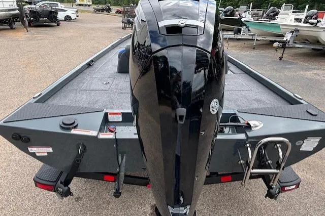 Slide: The Image of 2026 Ranger RT178C boat with powerful outboard motor, displayed in a marina setting. - 4