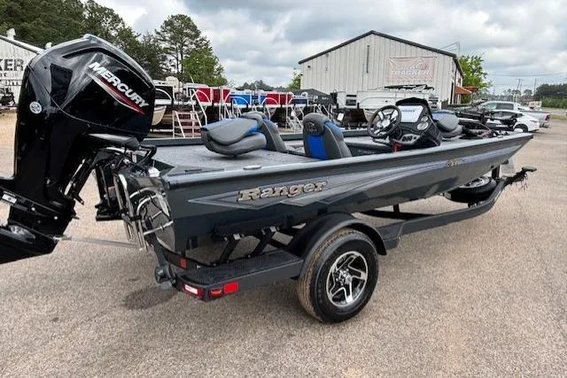 Slide: The Image of 2026 Ranger RT178C fishing boat with Mercury engine on trailer, parked outdoors. - 5