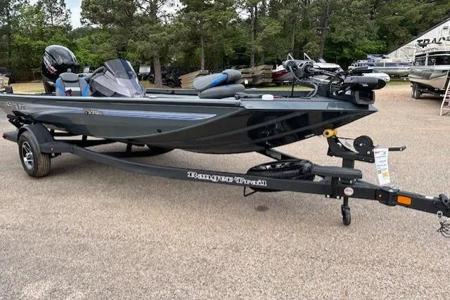 Slide: The Image of 2026 Ranger RT178C fishing boat on trailer, parked outdoors. - 6