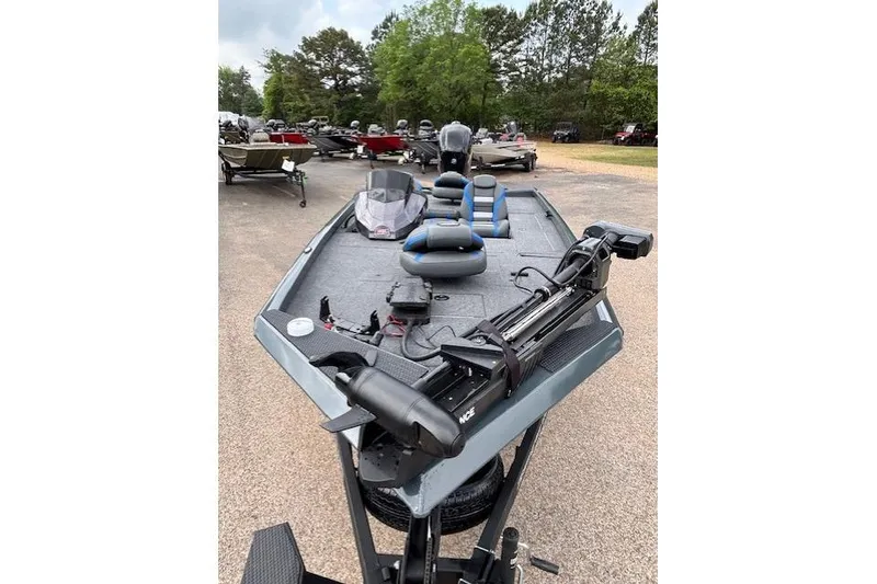 Slide: The Image of 2026 Ranger RT178C fishing boat with trolling motor, parked outdoors. - 7