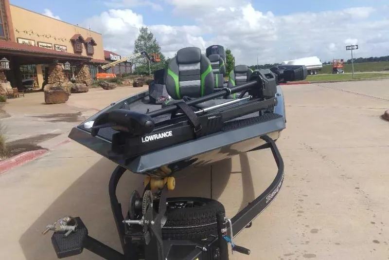 Slide: The Image of 2026 Ranger RT198P boat with Lowrance equipment, parked outdoors on a sunny day. - 84