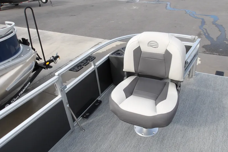 Slide: The Image of 2026 Sun Tracker Bass Buggy 18 DLX pontoon boat seat, gray and white upholstery. - 14