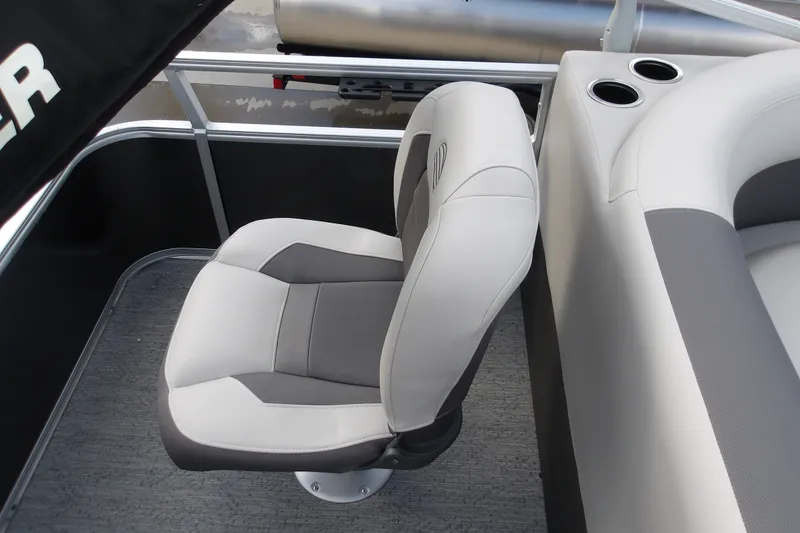 Slide: The Image of 2026 Sun Tracker Bass Buggy 18 DLX boat seat with cup holders, gray and white upholstery. - 16