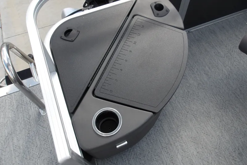 Slide: The Image of 2026 Sun Tracker Bass Buggy 18 DLX fishing station with integrated ruler and cup holder. - 15