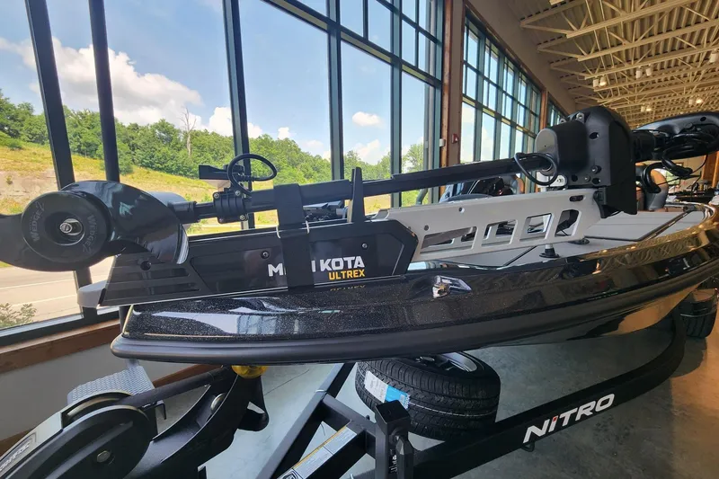 Slide: The Image of 2026 Nitro Z19 XL Pro boat with Minn Kota Ultrex motor in showroom. - 6
