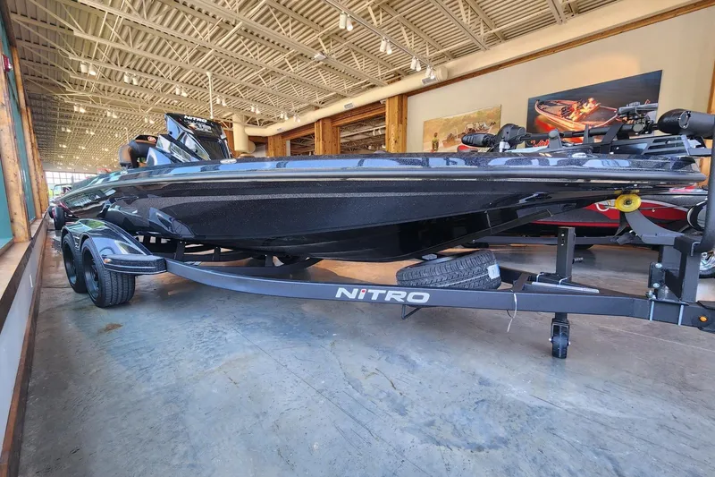 Slide: The Image of 2026 Nitro Z19 XL Pro boat displayed indoors on a trailer. - 2
