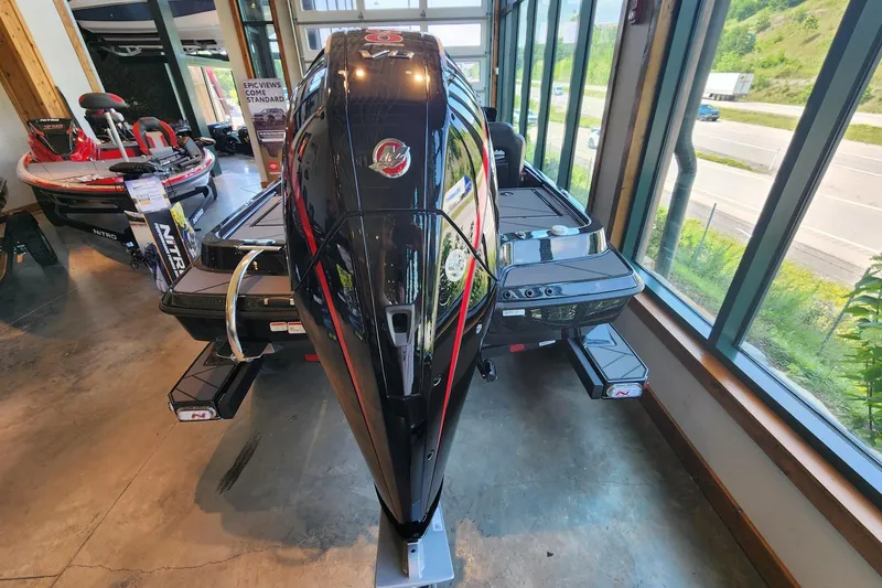 Slide: The Image of 2026 Nitro Z19 XL Pro boat displayed indoors with scenic window view. - 7