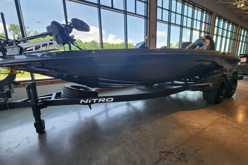 Slide: The Image of 2026 Nitro Z19 XL Pro boat displayed indoors with trailer, large windows in background. - 1