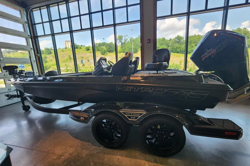 The Image of 2026 Nitro Z19 XL Pro boat in showroom, featuring sleek design and powerful engine. - 0