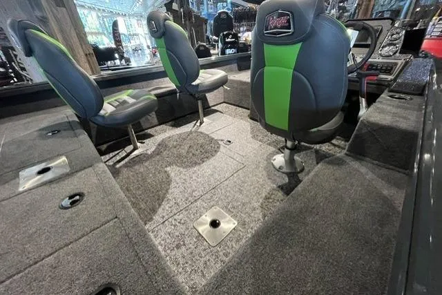 Slide: The Image of Interior of 2026 Ranger VS1782SC Angler boat with green-accented seats and carpeted flooring. - 6