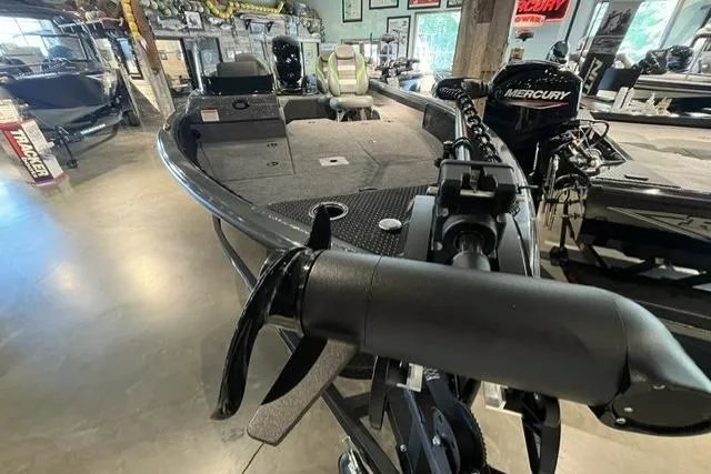 Slide: The Image of 2026 Ranger VS1782SC Angler boat with Mercury engine in showroom setting. - 7