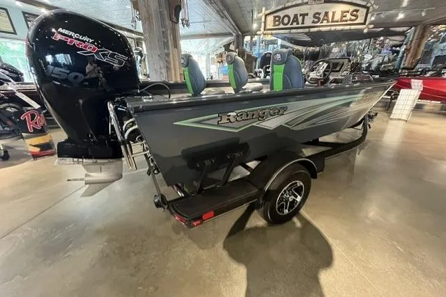 Slide: The Image of 2026 Ranger VS1782SC Angler boat displayed in showroom with Mercury Pro XS engine. - 1