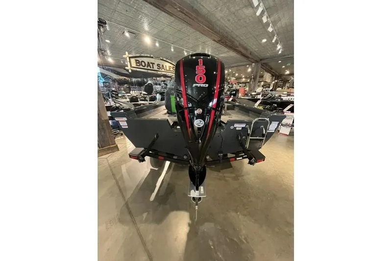 Slide: The Image of 2026 Ranger VS1782SC Angler boat with 150 HP engine displayed at a boat sales showroom. - 8