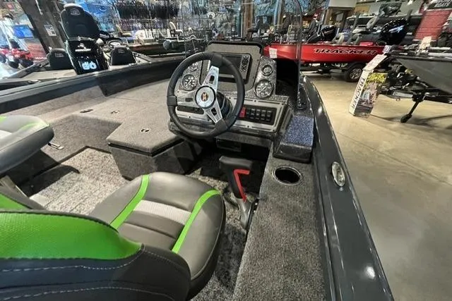 Slide: The Image of Interior of 2026 Ranger VS1782SC Angler boat with steering wheel and seating. - 2