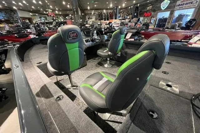 Slide: The Image of 2026 Ranger VS1782SC Angler boat interior with green-accented seats in a showroom. - 5