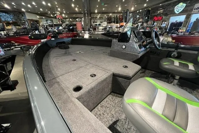 Slide: The Image of 2026 Ranger VS1782SC Angler boat interior with seating and control panel in showroom. - 3