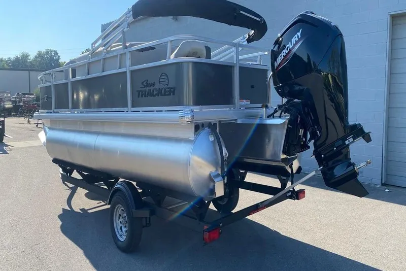 Slide: The Image of 2026 Sun Tracker Bass Buggy 18 DLX pontoon boat with Mercury outboard motor. - 85