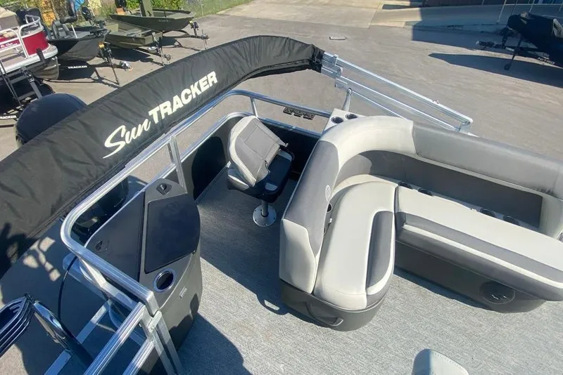 Slide: The Image of 2026 Sun Tracker Bass Buggy 18 DLX pontoon boat with seating and canopy. - 87