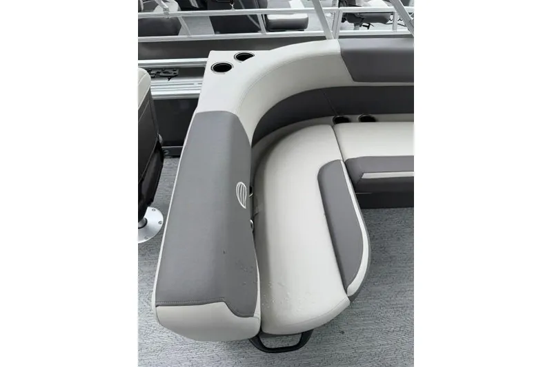 Slide: The Image of 2026 Sun Tracker Bass Buggy 18 DLX pontoon boat seating with cup holders and gray upholstery. - 92