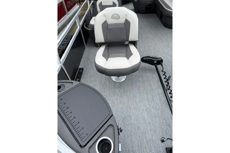 Slide: The Image of 2026 Sun Tracker Bass Buggy 18 DLX interior with swivel seat and fishing equipment. - 91