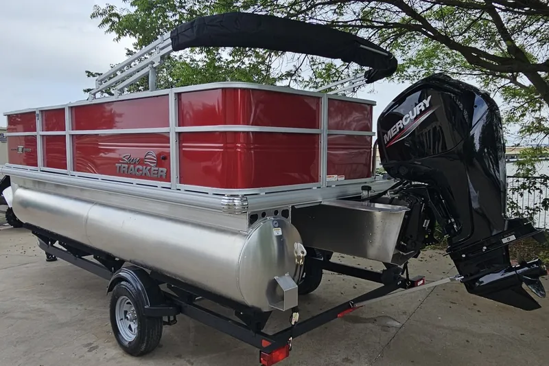 Slide: The Image of 2026 Sun Tracker Party Barge 18 DLX pontoon boat with Mercury outboard motor. - 6