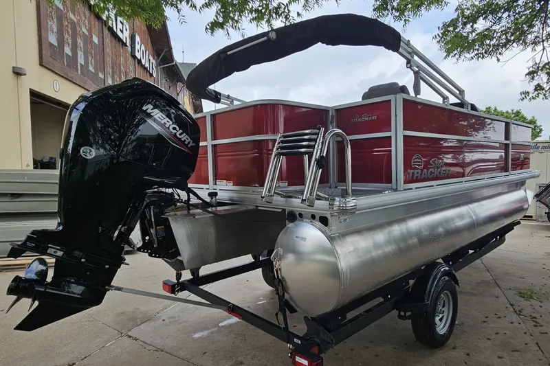 Slide: The Image of 2026 Sun Tracker Party Barge 18 DLX pontoon boat with Mercury outboard motor. - 4