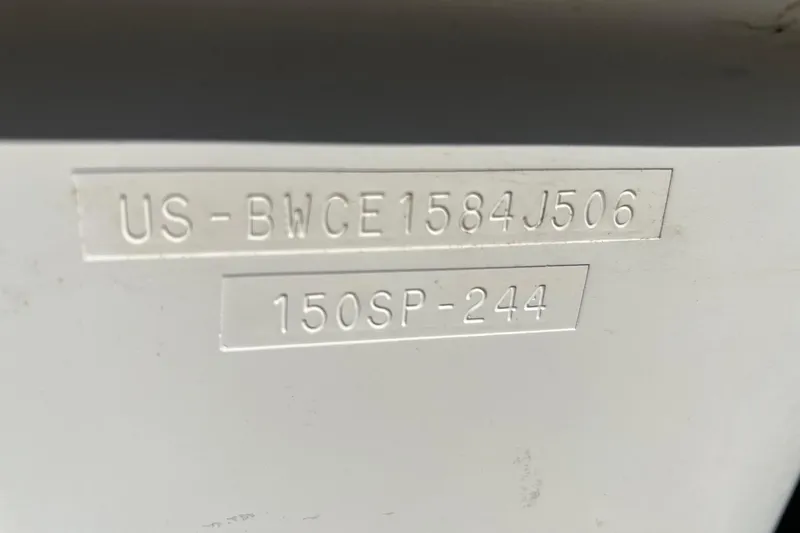 Slide: The Image of Hull identification number on a 2006 Boston Whaler 150 Sport boat. - 13