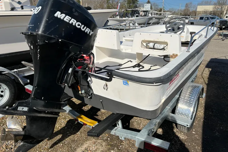 Slide: The Image of 2006 Boston Whaler 150 Sport boat with Mercury engine on trailer. - 2