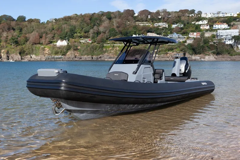 Slide: The Image of 2026 Brig Eagle 8 boat on a scenic coastal shoreline. - 5