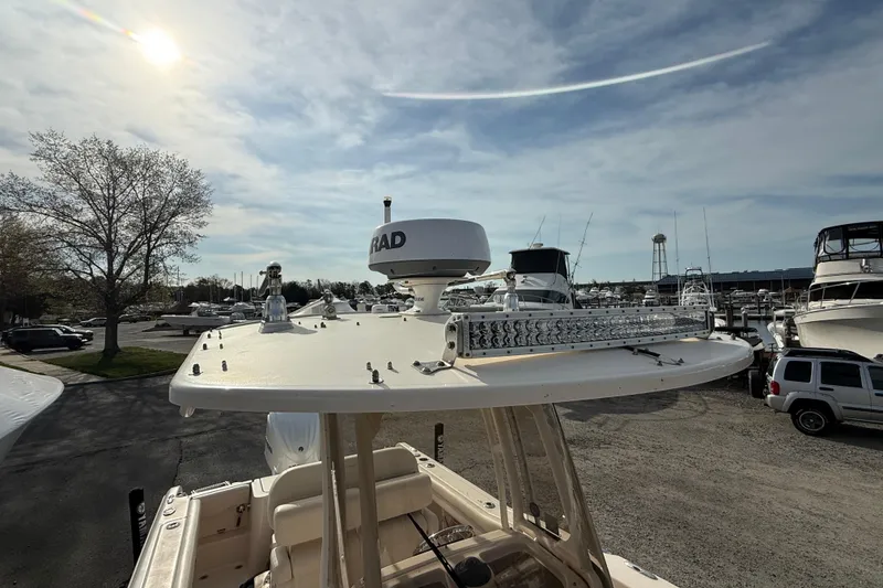 Slide: The Image of 2021 Grady-White Fisherman 236 boat with radar and light bar, docked in marina. - 11