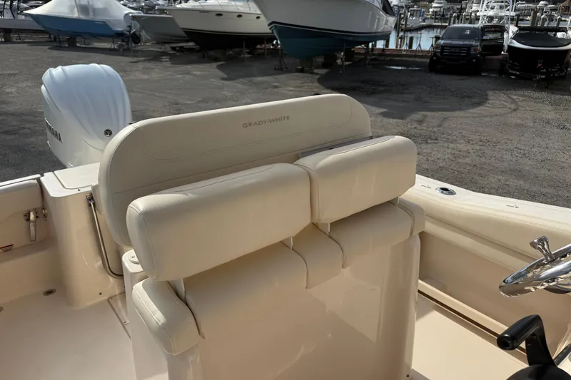 Slide: The Image of 2021 Grady-White Fisherman 236 boat interior with seating and Yamaha engine. - 14