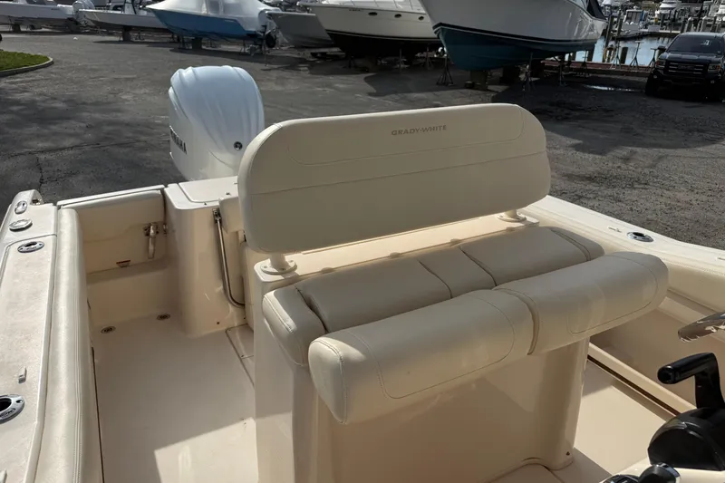 Slide: The Image of 2021 Grady-White Fisherman 236 boat interior with seating and engine view. - 15