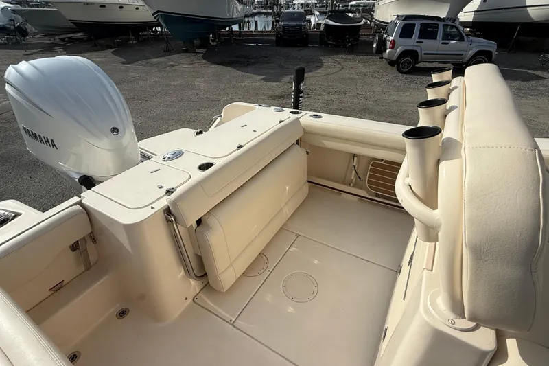Slide: The Image of 2021 Grady-White Fisherman 236 boat interior with Yamaha engine, docked in a marina. - 16