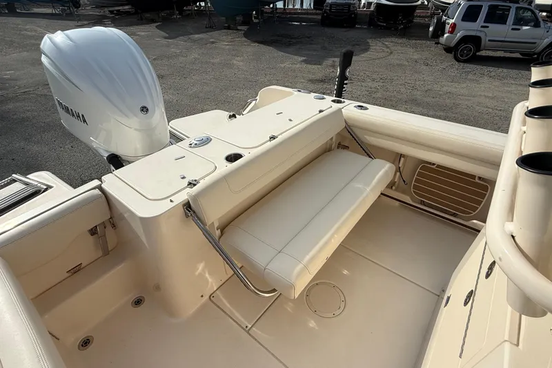 Slide: The Image of 2021 Grady-White Fisherman 236 boat interior with Yamaha engine, featuring foldable seating. - 17