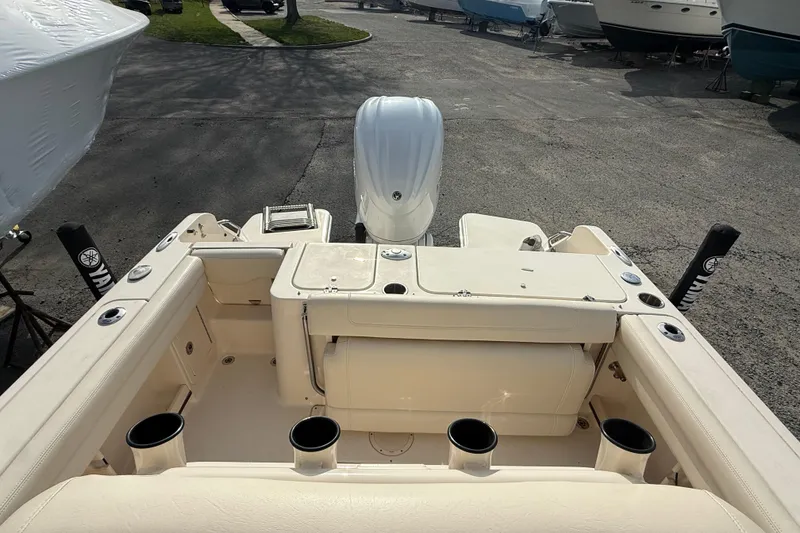 Slide: The Image of 2021 Grady-White Fisherman 236 boat interior with seating and rod holders. - 19