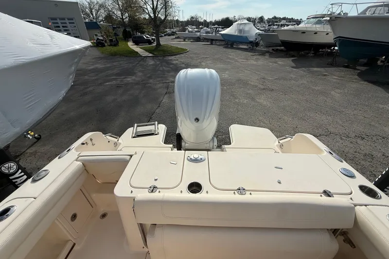 Slide: The Image of 2021 Grady-White Fisherman 236 boat interior with outboard motor in a marina setting. - 20