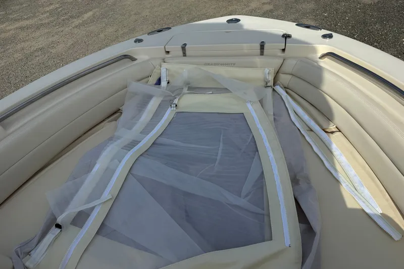 Slide: The Image of 2021 Grady-White Fisherman 236 boat interior with beige seating and protective cover. - 25