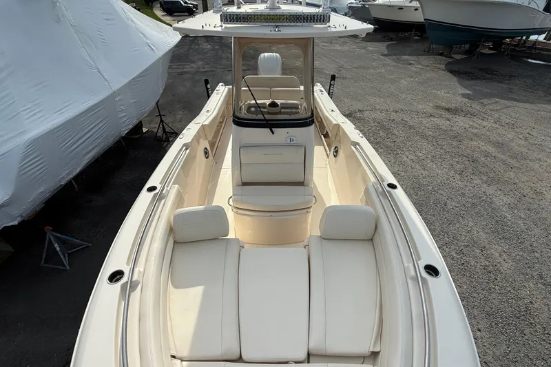Slide: The Image of 2021 Grady-White Fisherman 236 boat with spacious seating, parked on gravel. - 5