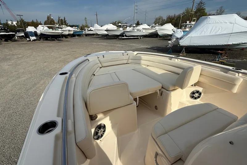 Slide: The Image of 2021 Grady-White Fisherman 236 boat interior with seating, parked among other boats. - 6