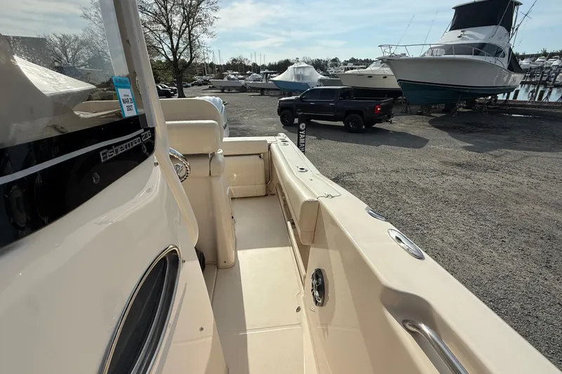 Slide: The Image of 2021 Grady-White Fisherman 236 boat docked, showcasing spacious deck and sleek design. - 8