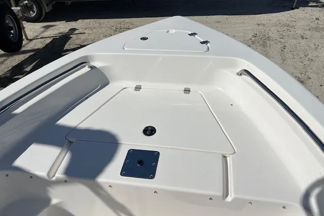 Slide: The Image of 2026 Key West 189 FS boat deck, featuring sleek white design and storage compartments. - 10