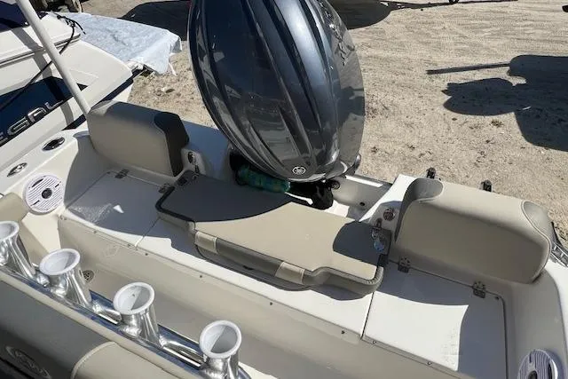 Slide: The Image of 2026 Key West 189 FS boat interior with motor and seating. - 2