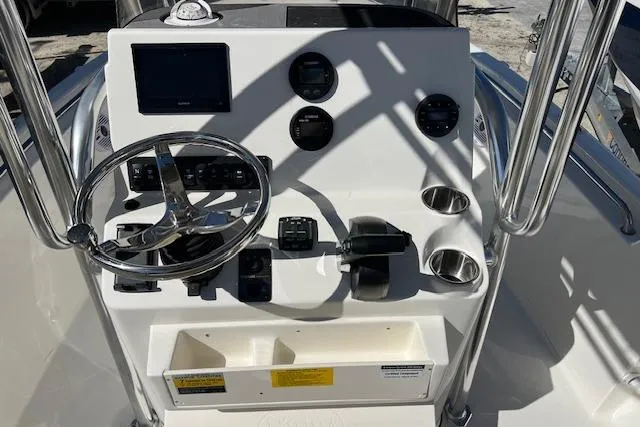 Slide: The Image of 2026 Key West 189 FS boat console with steering wheel, gauges, and controls. - 5