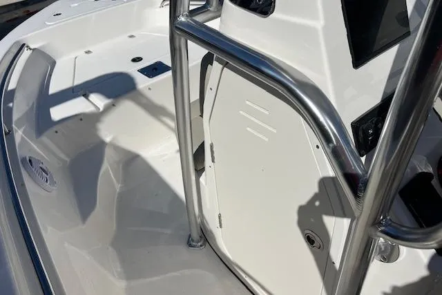 Slide: The Image of 2026 Key West 189 FS boat interior with stainless steel railing and seating area. - 7