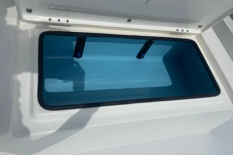 Slide: The Image of Open storage compartment on 2023 Shallow Sport 18 Sport boat. - 11